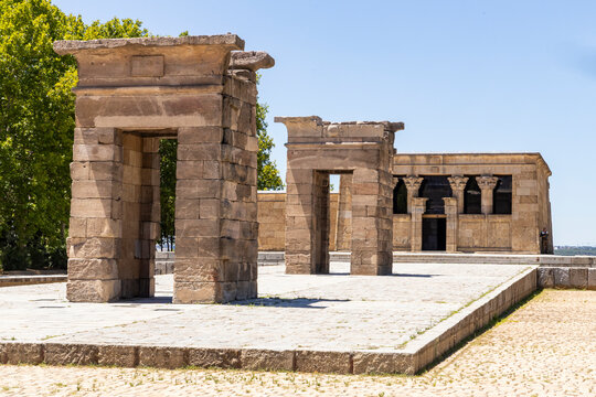 Temple of Debod in Madrid. Important square with a temple, arches and a beautiful walkway surrounded by a pool. Ancient bricks, hieroglyphs, signs and symbols of a bygone era. A suggestive view.