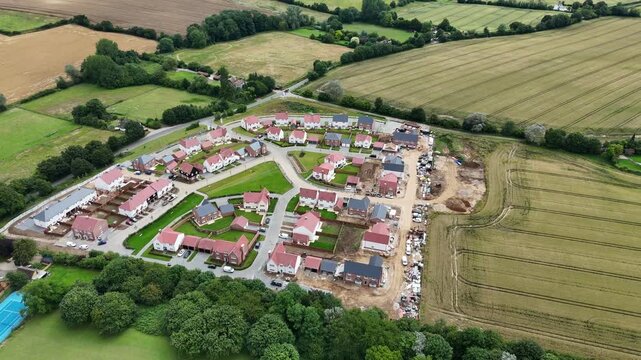 New build houses under construction in Finchingfield Essex England drone aerial