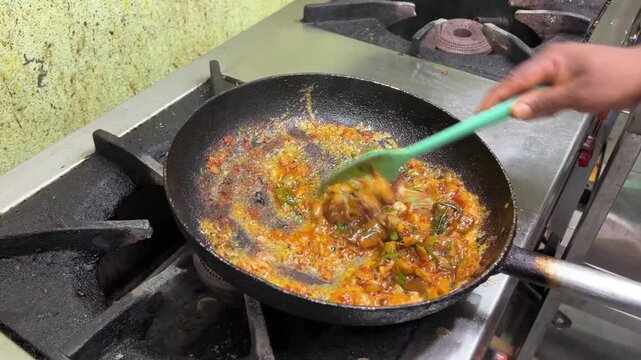 Close up shot of cooking of sukha mutton. A south Indian mutton dish.