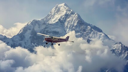 A small aircraft circling a snow capped peak