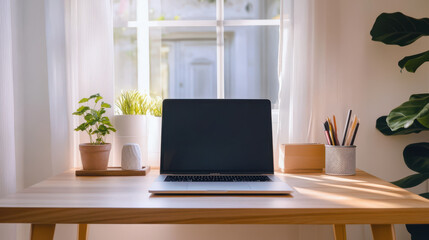 A minimalist Scandinavian desk setup with a laptop and neat organization