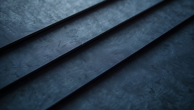 Close-up of dark, textured surface with parallel lines.