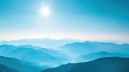 Obraz premium Blue Mountains and Sky Wallpaper. A serene landscape wallpaper with a distant mountain range bathed in blue hues under a clear sky.