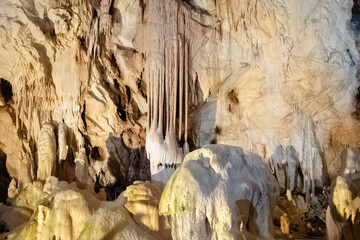 Stalactites and stalagmites creating beautiful formations in a cave