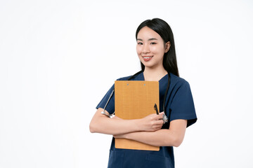 Young asian female doctor in uniform and stethoscope smiling and looking at camera while standing with clipboard in hands on white background. Healthcare and medical concept.