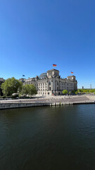 Fototapeta premium Reichstag Dom, Berlin. View from the river to the building