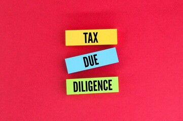 colored paper with the word Tax due diligence.