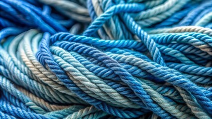 Fototapeta premium Intertwined soft chenille threads in serene blue hues weave together, forming a cozy, intricate texture that invites tactile exploration in this warm, serene close-up image.