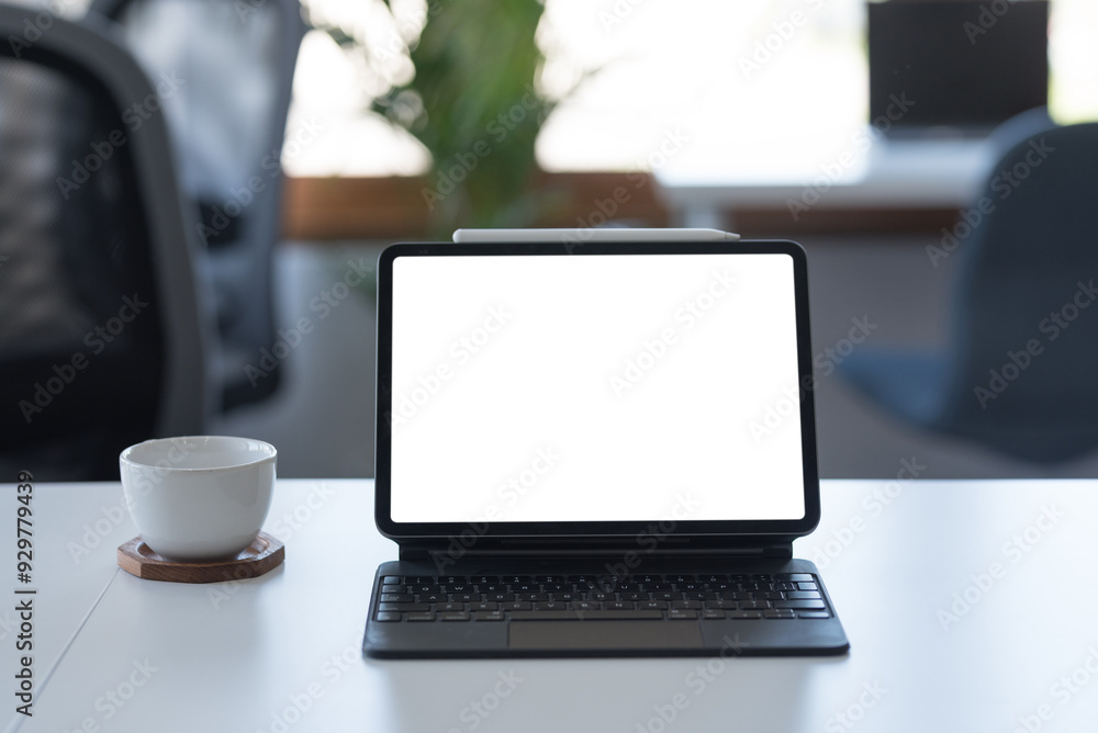 Poster modern tablet with blank screen is standing on a work desk in a minimalist home office, perfect setu