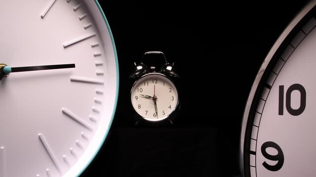 Dynamic slider studio timelapse of 3 clocks racing. Urgent, stress, countdown