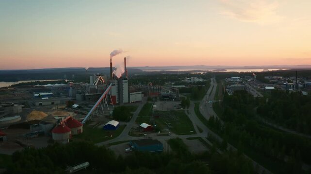 4K Aerial Drone Footage of a Factory in Pite&aring; Sweden with Beautiful Sunset in the Background.