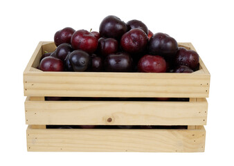 Fresh cherry plums in wooden crate isolated on white background	