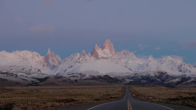 a pan of monte fitzroy and the road to el chalten at dawn on an autumn morning in patagonian argentina