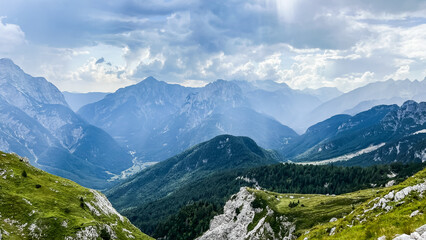 mountains and clouds Mangart Julian Alps 2,679 meters peak hiking nature Slovenia
