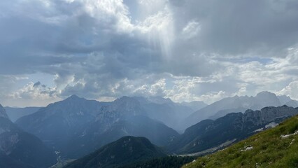 Fototapeta premium mountains and clouds Mangart Julian Alps 2,679 meters peak hiking nature Slovenia 