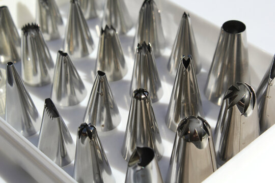 Group of metal piping tips nozzles used for cake decorating