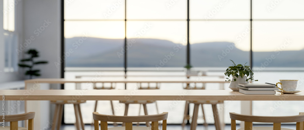 Poster a space for displaying products on a wooden table in a modern minimalist co-working space.