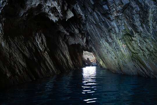 Cave called ""Grotta delle Spigole" between the cliffs of the coast near Masua, south of the island of Sardinia with crystal clear water