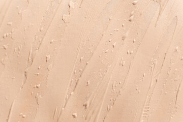 Abstract delicate minimalist beige background, cosmetic cream stroke.