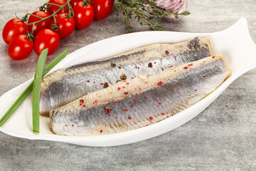 Marinated herring fillet with green onion