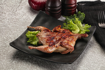 Grilled quail in the plate