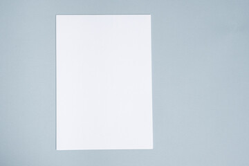 Blank Sheet of Paper on Blue Background, Top View, Space for Text