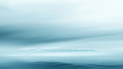 Obraz premium A blue sky with a few clouds and a body of water
