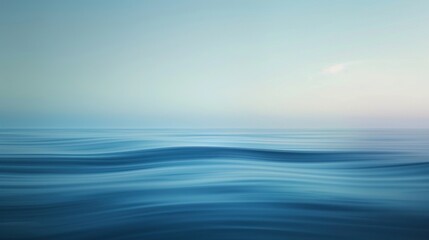 Obraz premium A calm ocean with a blue sky in the background