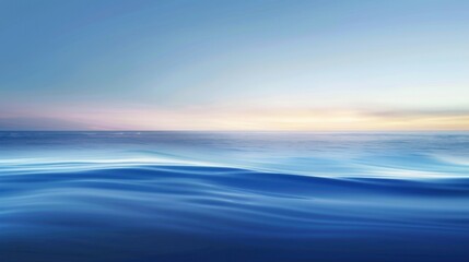 Obraz premium A calm ocean with a beautiful blue sky in the background