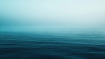 The image is of a calm, blue ocean with no visible waves