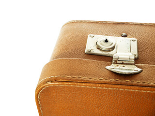 A brown leather suitcase with a silver lock. The suitcase is on a white background. Old style...