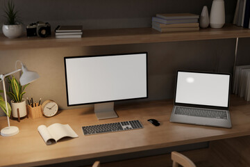 A home workspace at night features a computer and a laptop mockups on a wooden table.