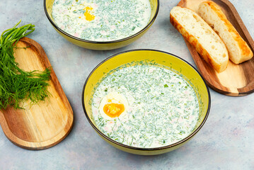 Summer soup okroshka on a table.