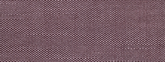 Texture brown background from woven textile material with wicker pattern, macro. Vintage umber fabric cloth
