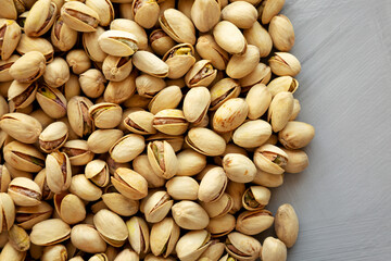 Roasted and Salted Pistachios on a gray surface