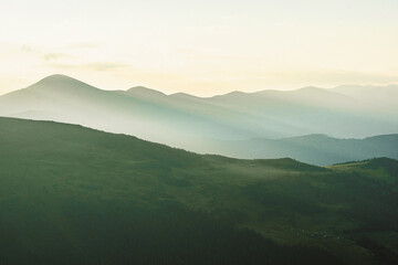 landscape in the mountains silhouettes of mountains, forest, travel, in green tones, wallpaper, poster, cover