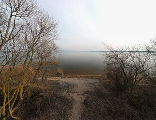 Drone view of the river, forest and fields, top view and blue sky