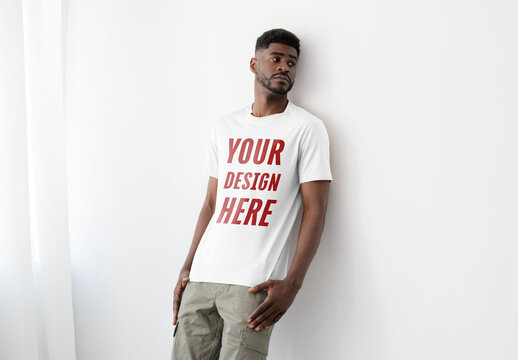Mockup Of Man Wearing Customizable T-Shirt Leaning Against Wall