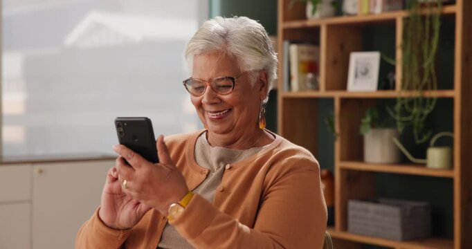 Senior woman, mobile and typing in house with happiness for conversation, funny and good news. Elderly person, smartphone and speaking with smile or excited for gossip, chat and social media meme