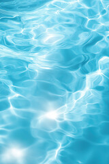 Obraz premium Abstract image of bright blue water surface with light reflections. Gentle ripples and shimmering light patterns create a soothing aquatic background, perfect for relaxation themes.
