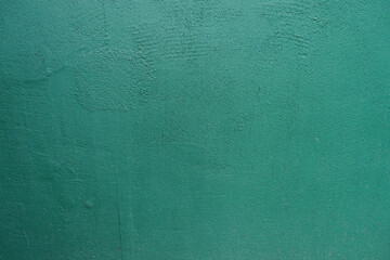 Front view of dark teal green painted wall