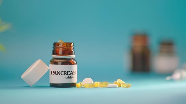 HAND TAKING OUT PANCREAS TABLETS FROM MEDICINE BOTTLE