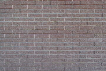 Background - pink split face brick veneer wall with stretcher bond pattern