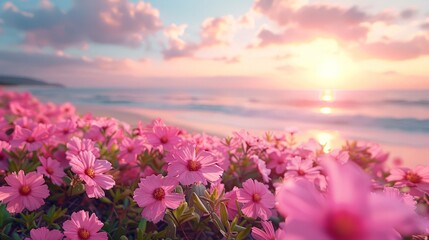 Fototapeta premium Flowerbed with pink flowers with blurred sea view and empty beach in morning.