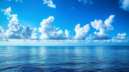 Obraz premium Beautiful blue ocean with blue sky and clouds background
