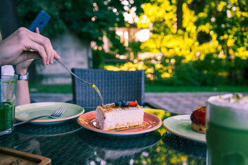 A person is eating a piece of cake with a fork