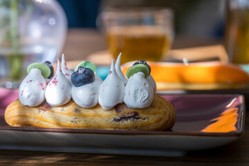 A dessert with whipped cream and blueberries on top