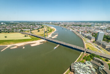 High top panoramic wide angle view of Rhine river and bridge from Dusseldorf Rhine Tower in North Rhine-Westphalia, Germany