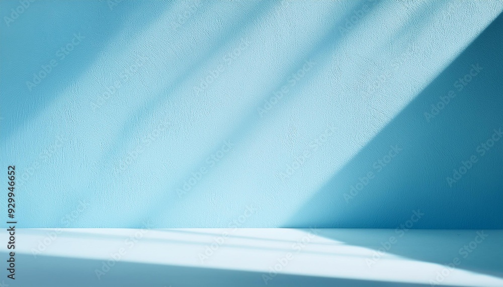 Wall mural minimal abstract light blue background for product presentation shadow and light from window