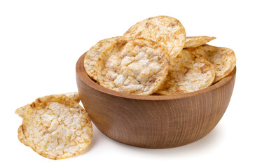 Rice chips in a wooden plate and scattered on a white background. Isolated